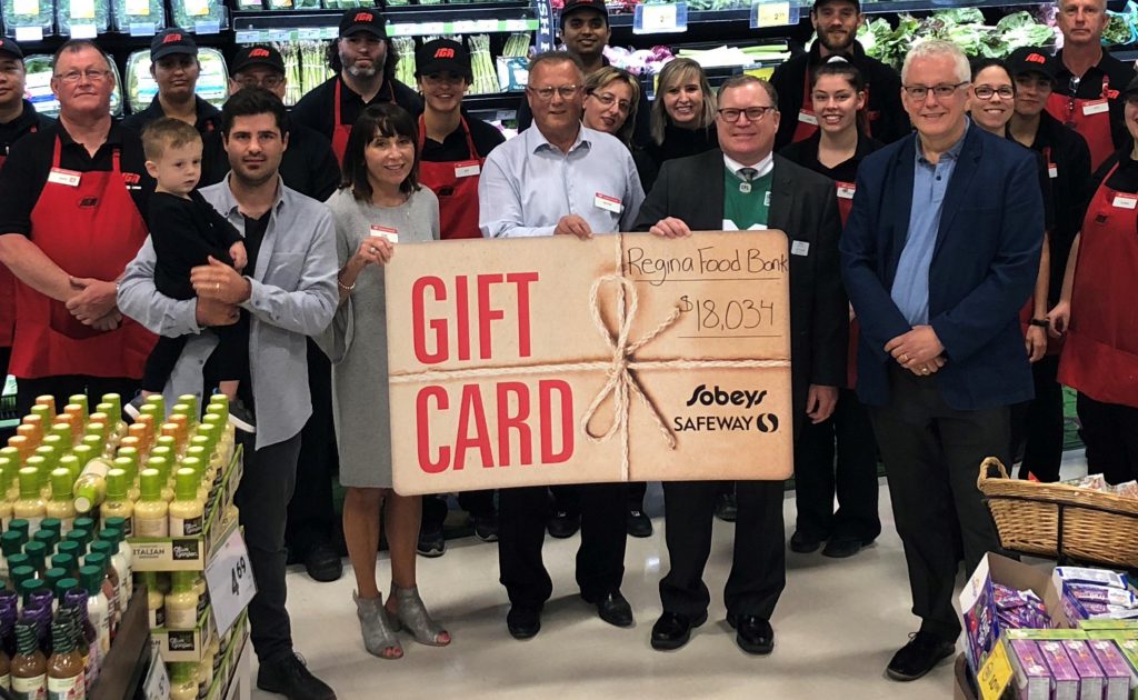 Safeway emloyees with food bank donation